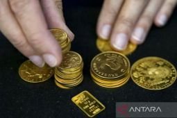 Emas naik tipis setelah di harga terendah dalam 3 minggu
