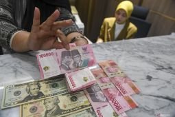 Jumat pagi rupiah menguat menjadi Rp17.718 per dolar AS