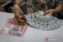 Jumat ini rupiah menguat menjadi Rp18.123 per dolar AS